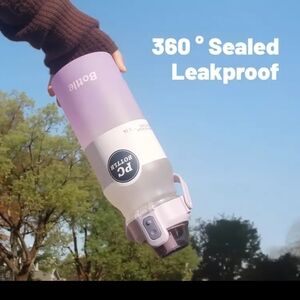 Stylish pink 68 oz strong plastic water bottle with a bounce straw lid.